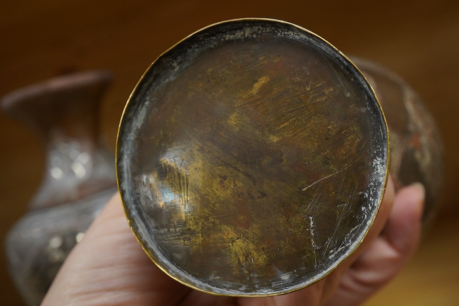 A pair of Cairoware silver and copper inlaid brass vases, 24cm high
